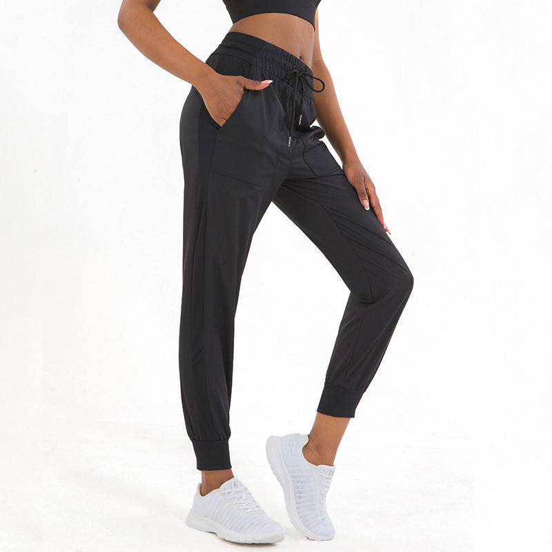 Women wearing Bellactiva activewear sets in a brightly lit studio, highlighting breathable leggings, supportive sports bras, and comfortable fit while smiling.