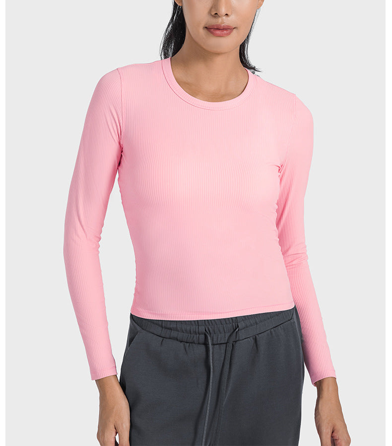 T-shirt de yoga à manches longues, coupe gainante, taille basse, col rond, style gainant, avec côtes verticales et élasticité optimale. Veste de yoga