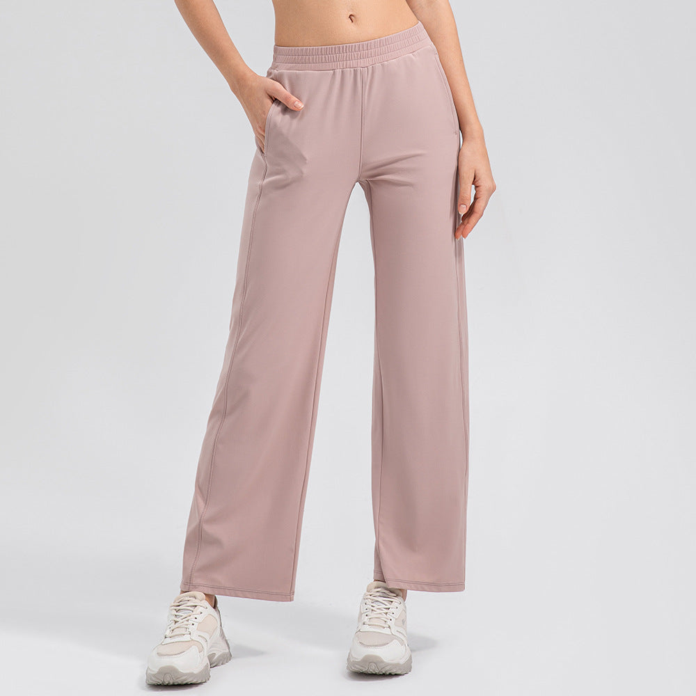 Pantalon de yoga ample effet seconde peau, taille haute, jambes larges et drapées, très élastique, collection Breathing Series.
