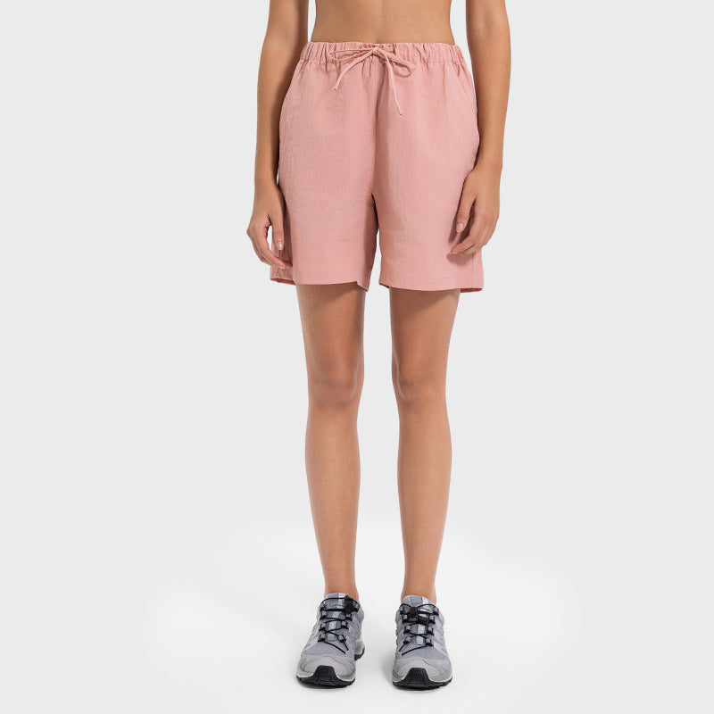 Short de printemps-été confortable à taille élastique, sensation de fraîcheur et séchage rapide, idéal pour les sports de plein air et le yoga. Respirant et absorbant l'humidité.