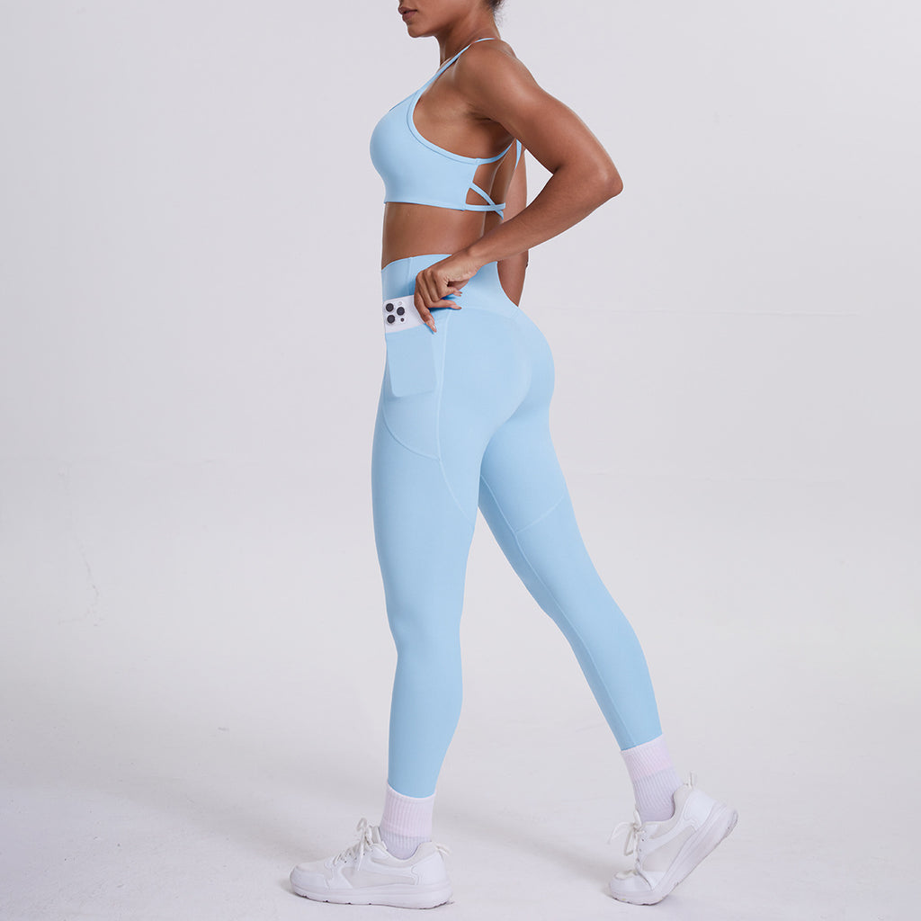 Pantalon de sport effet seconde peau, poches, dos nu galbant, idéal pour la course, le fitness et le yoga.