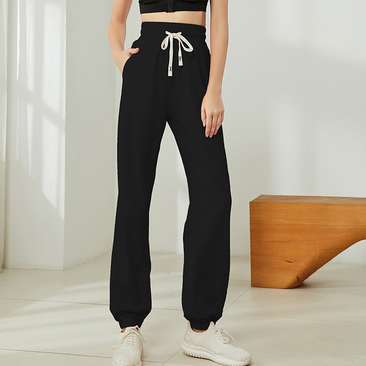 Pantalones deportivos informales para correr y fitness, holgados y cómodos, con cordón y cintura alta para mujer, con realce de cadera y tacto color piel.