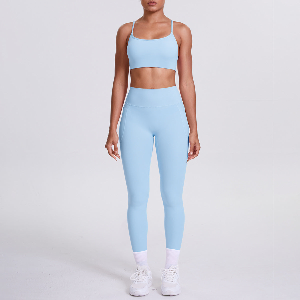 Pantalon de sport effet seconde peau, poches, dos nu galbant, idéal pour la course, le fitness et le yoga.