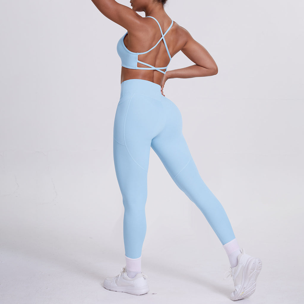Pantalon de sport effet seconde peau, poches, dos nu galbant, idéal pour la course, le fitness et le yoga.